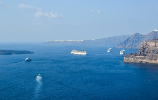 Santorini, Greece - June 20, 2016: Cruise ship in the deep ocean caldera of Santorini, Greece. Photo taken during a hot summer day.