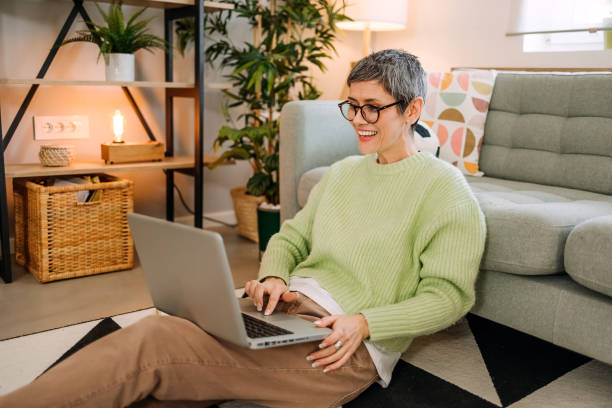 Woman makes a video call at home stock photo