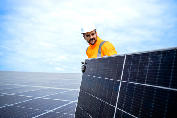 istock Experienced worker installing solar panels for sustainable energy production. 1469431934