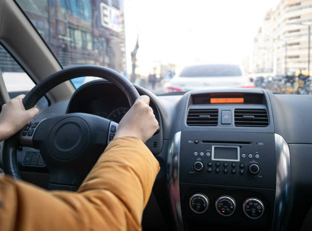 istock Hand Holding a Steering Wheel Driving 1469432261