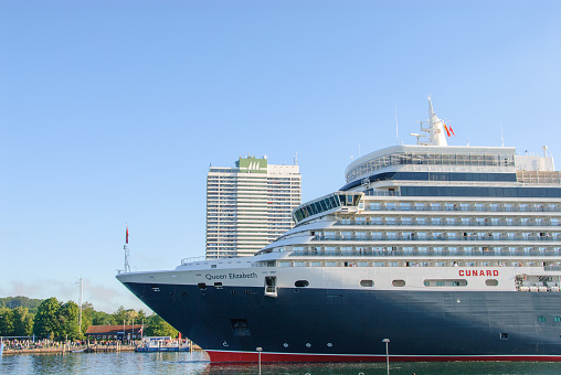 the luxury cruise ship Queen Elisabeth enters the port of Luebeck-Travemuende
