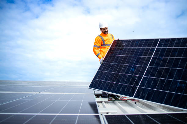 istock Process of solar panel installation in sustainable energy power plant. 1469433578