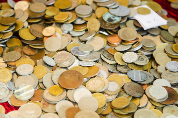 Old coins at the flea market, close-up, selective focus.