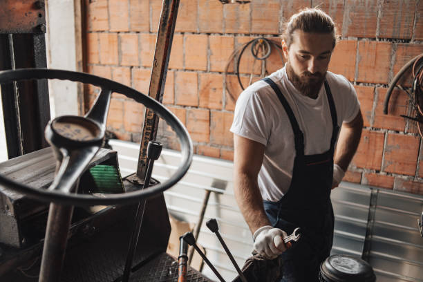 istock The man works in a mechanic's workshop 1469446198
