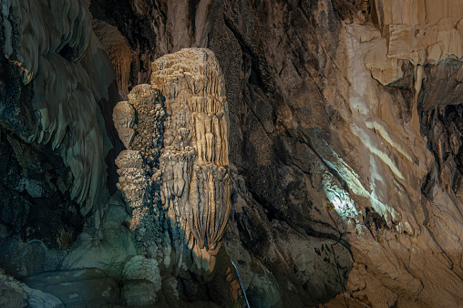 The formation of stalagmites and columns hanging on the wall of Altınbeşik Cave
