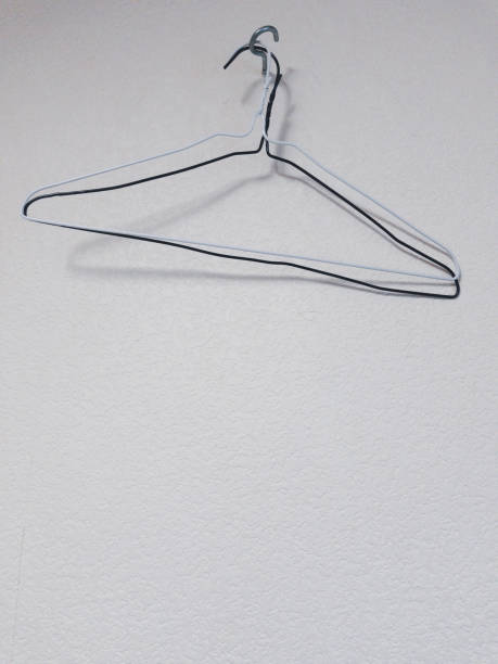 istock Two wire coat hangers on hotel wall 1469449491