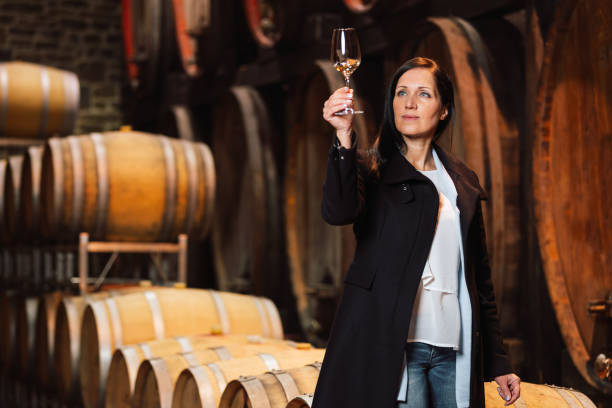 istock Woman tasting wine at the wine cellar 1469452809
