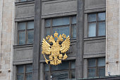 Golden coat of arms of Russia on the facade State Duma building at Moscow, Russia.