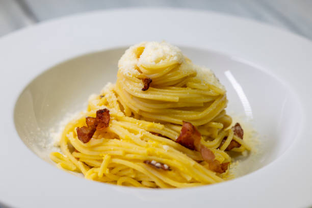 still life of spaghetti alla carbonara stock photo