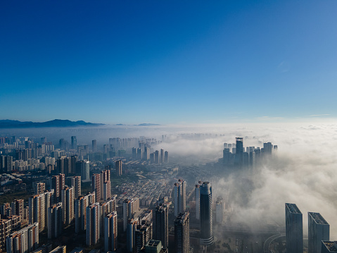 Aerial view of urban buildings in the morning fog