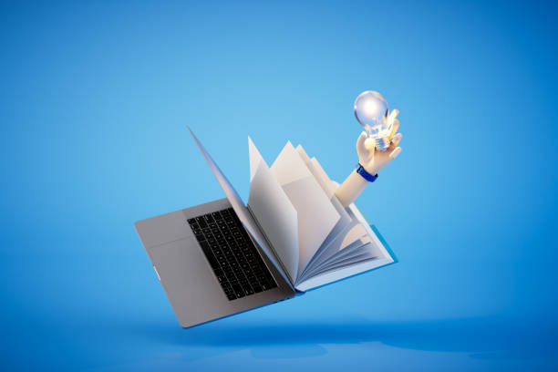 istock An open book and laptop and a hand in which is a light bulb on a blue background. 3D render 1469457673
