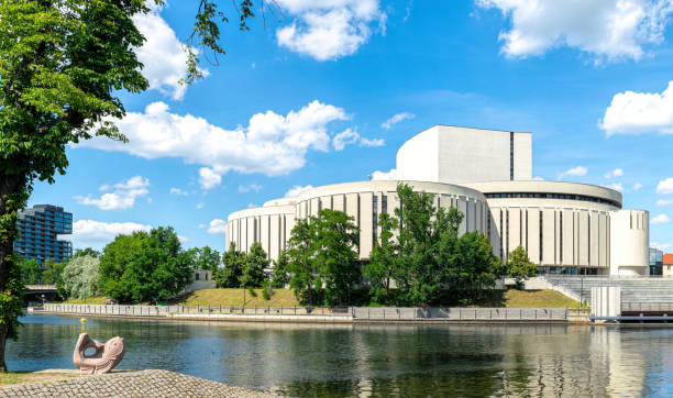 Bydgoszcz, Poland - June 22, 2022: Famous Opera Nowa, modern theatre in the historical district in Bydgoszcz, Poland. Beautiful view of the Mill's Island, tourist landmark