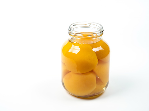 Canned Yellow Peach on White Background