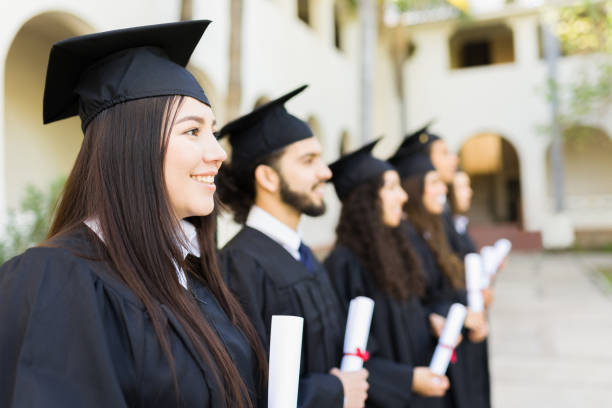 istock Group of graduates smiling on their graduation ceremony 1469464611