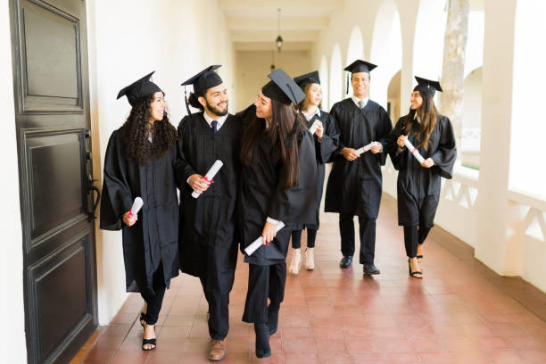 istock Group of graduates feeling excited after graduating university 1469464742