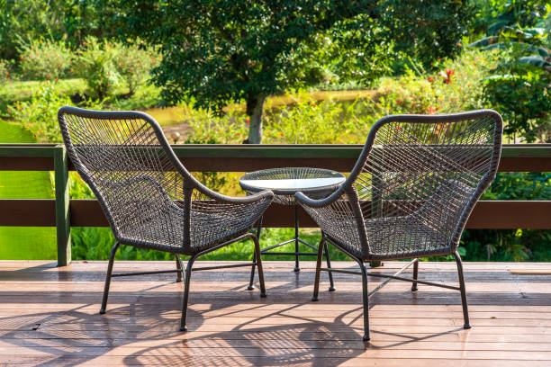 istock Two chairs and table on the backyard in tropical garden with beautiful view 1469465267