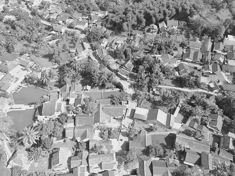 Black and white photo Aerial view of a low rise residential district in the Bandung area - Indonesia.