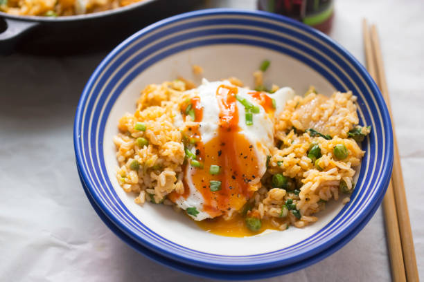 istock Kimchi fried rice with peas, fried egg and sriracha sauce 1469467178