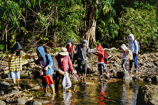 Binh Phuoc, Vietnam JAN 28 2023: people exploring the riverside in of Bu Gia Map National Park in Vietnam, a popular spot for adventurous hikes