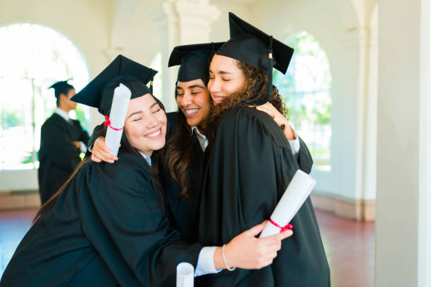 istock Excited women hugging celebrating graduating university 1469471488