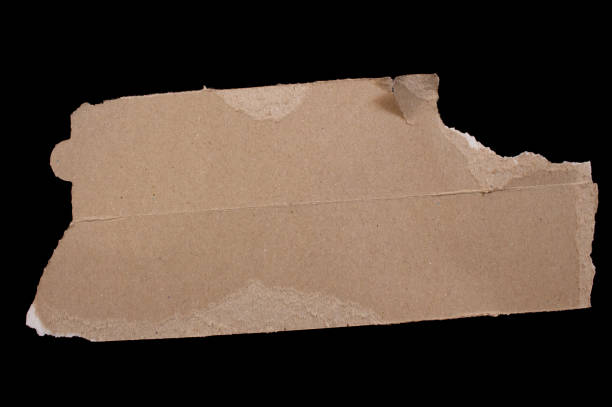 istock Ripped cardboard paper piece on a black background 1469473251