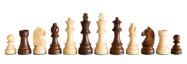 Wooden chess pieces isolated on white background