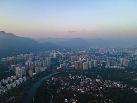 Aerial view of urban buildings at sunset