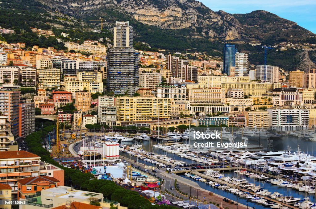 Astonishing landscape view of La Condamine ward and Port Hercules in Monaco. Port Hercules is the only deep-water port in Monaco. Famous touristic place and travel destination in Europe Astonishing landscape view of La Condamine ward and Port Hercules in Monaco. Port Hercules is the only deep-water port in Monaco. Famous touristic place and travel destination in Europe. Aerial View Stock Photo