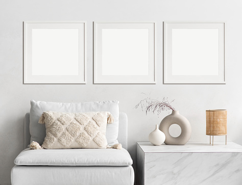 View of modern interior design. Minimalism boho style. Blank white empty frame mock ups for painting or poster.