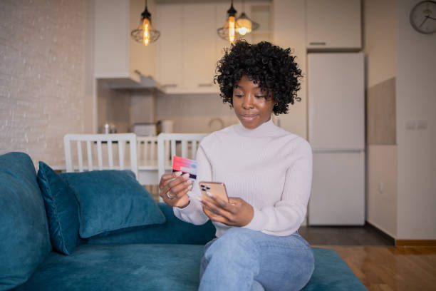 istock Happy young customer enjoys shopping online 1469484817