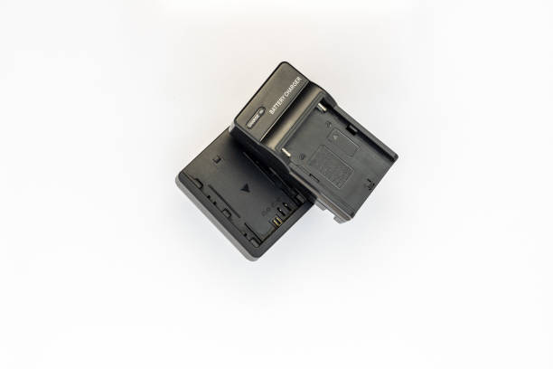 istock Digital camera and lighting equipment chargers isolated on white background 1469486937