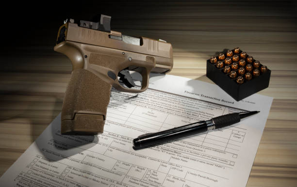 istock Form to purchase a gun with pistol and ammo 1469487746