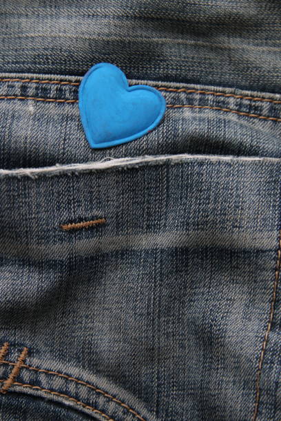 istock Blue heart on jeans. Birthday background. 1469488983