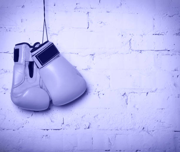 istock Pair of boxing gloves hanging on a wall 1469496919