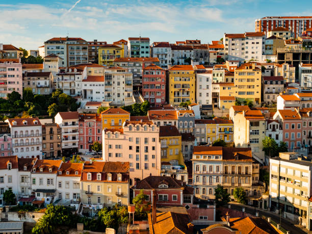 colored facades of the houses of coimbra, roman city located on a hill by the mondego river, portugal - porto portugal bridge international landmark imagens e fotografias de stock