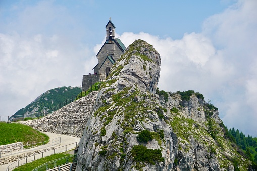 Stone church on a mountain in Bavaria. The church on the Wendelstein mountain in summer. A beautiful church high in the Alps.