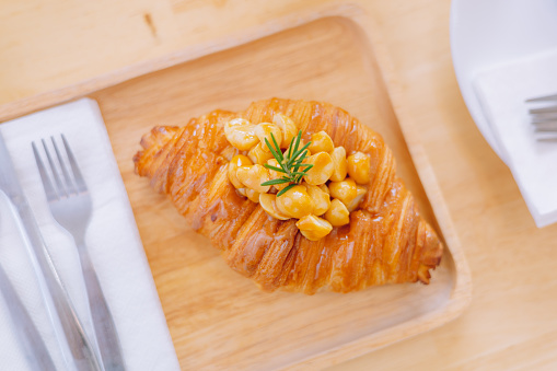 Croissant Bakery homemade on the table breakfast tray with gold and crispy