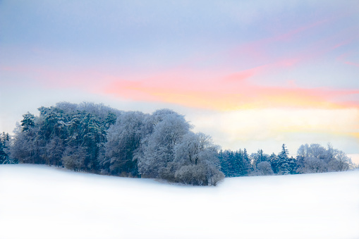 Sunset on a beautiful and cold evening in the Bavarian mountains. Upper Bavaria, Germany.