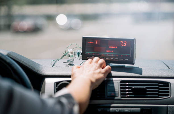 istock Woman's hand driving taxi machine. 1469504007