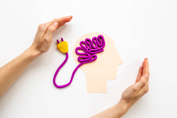 istock Brain charging and mental health and rest. Brain shape with human hands 1469504873