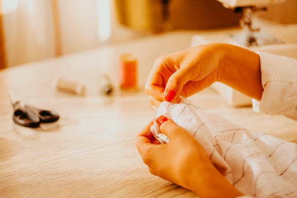 istock Female dressmaker creating clothes in workshop 1469506976