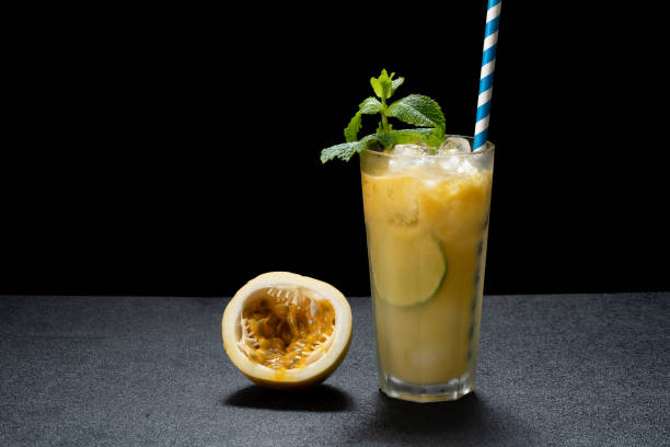 istock passion fruit mojito, passion fruit cocktail, passion frutis coollins, on a black background 1469507171