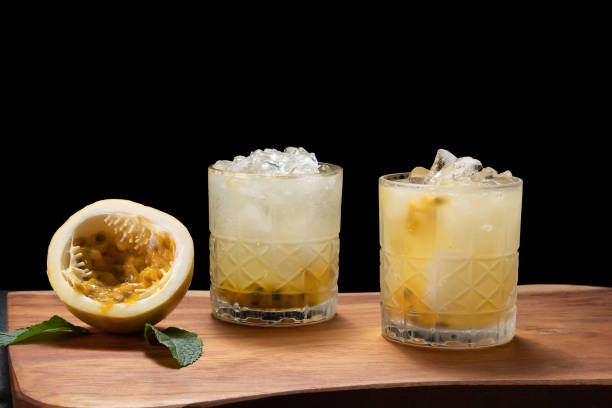 istock passion fruit mojito, passion fruit cocktail, passion frutis coollins, on a black background 1469507734