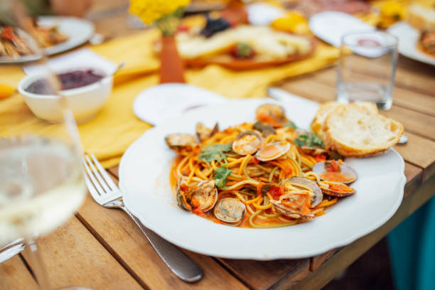 istock Seafood Spaghetti with seashells, prawns, squids on table background. 1469507819