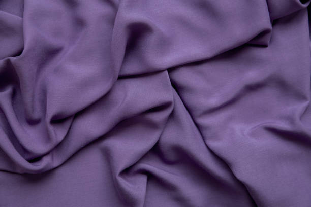 purple fabric background. the texture of the fabric. - article textile material new imagens e fotografias de stock