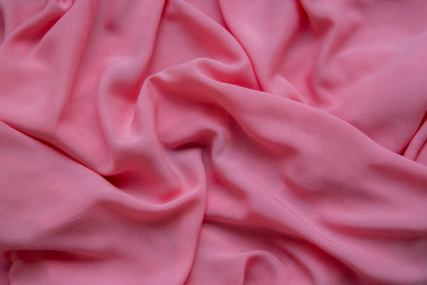 background from pink fabric. the texture of the fabric. - article textile material new imagens e fotografias de stock