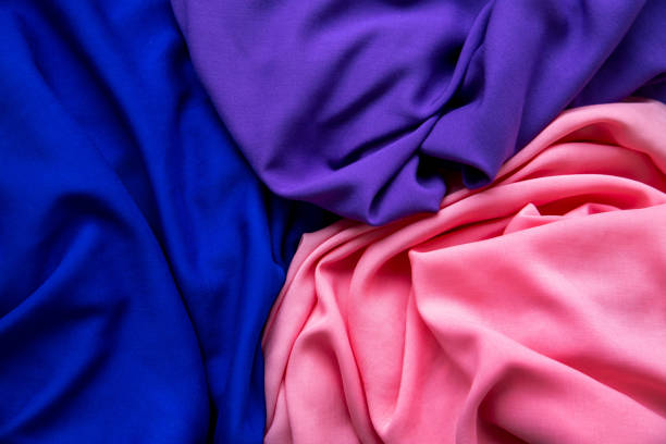 background from fabric cuts of different colors. the texture of the fabric. - article textile material new imagens e fotografias de stock