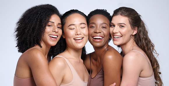 Face portrait, beauty and group of women in studio on gray background. Natural cosmetics, skincare and diversity of happy female models, friends or girls in makeup posing for self love or empowerment