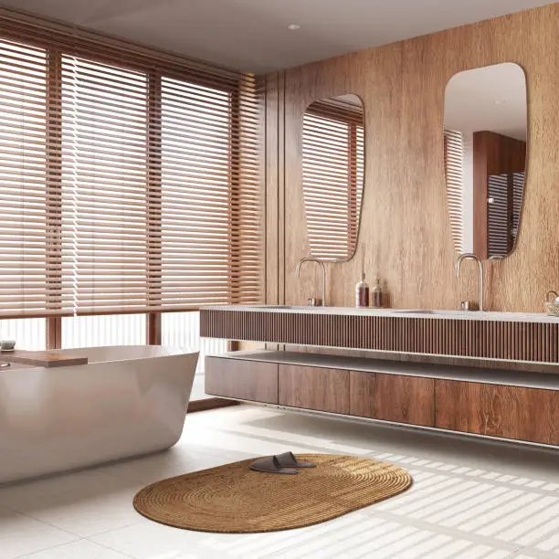 Modern wooden bathroom in white and beige tones. Freestanding bathtub, washbasin with mirror and marble tiles floor. Minimal japandi interior design