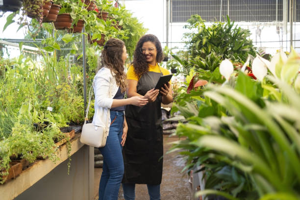 istock Owner and client in a flower shop 1469517717